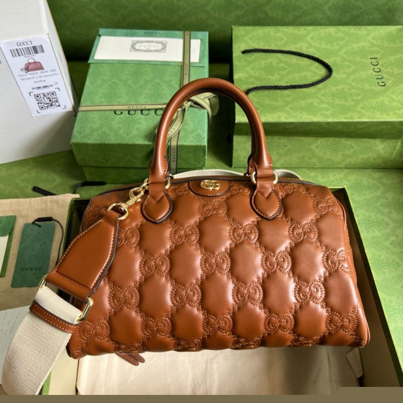 G*u*i top handle bags